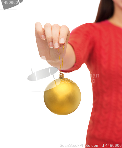 Image of close up of woman hand holding christmas ball