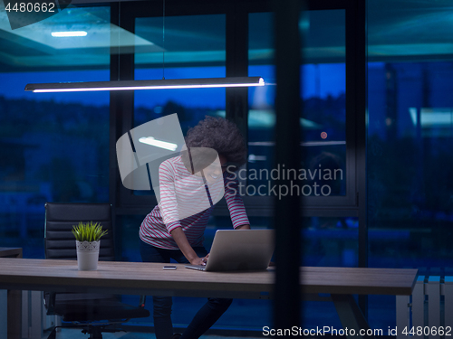 Image of black businesswoman using a laptop in startup office