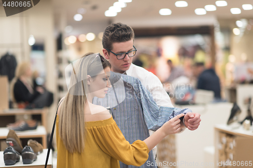 Image of couple in  Clothing Store