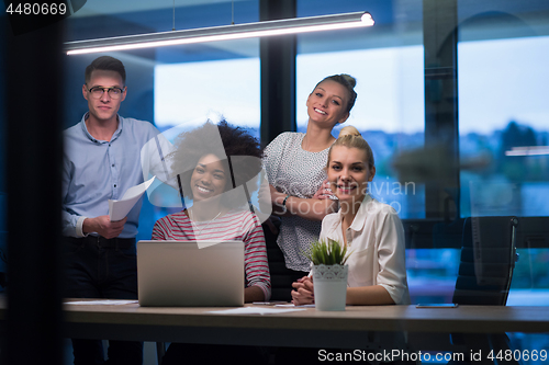 Image of Multiethnic startup business team in night office