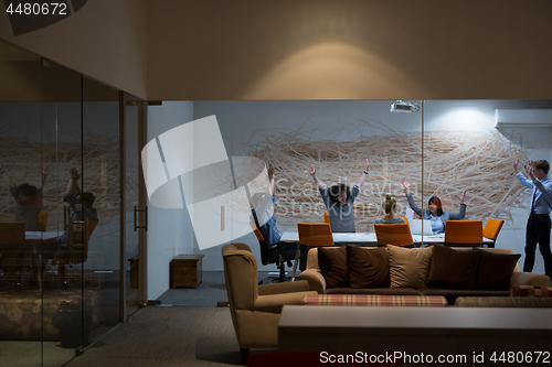 Image of Group of young business people throwing documents