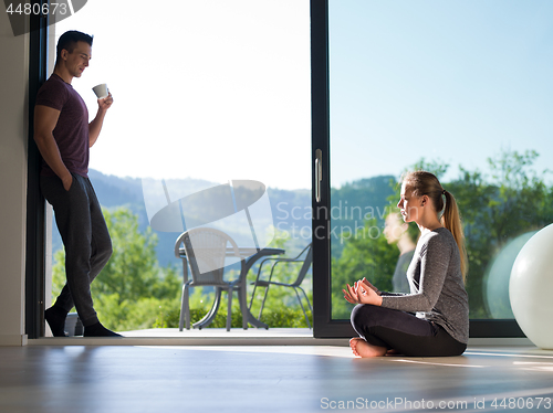 Image of couple on the door of their luxury home