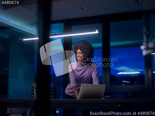 Image of black businesswoman using a laptop in startup office