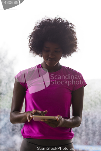 Image of african american woman using tablet