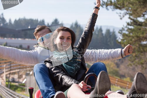 Image of couple enjoys driving on alpine coaster