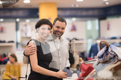 Image of couple chooses shoes At Shoe Store