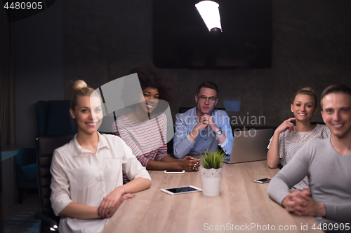 Image of Multiethnic startup business team in night office