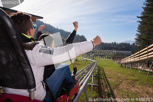 Image of couple enjoys driving on alpine coaster