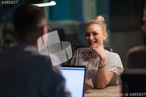 Image of Multiethnic startup business team in night office