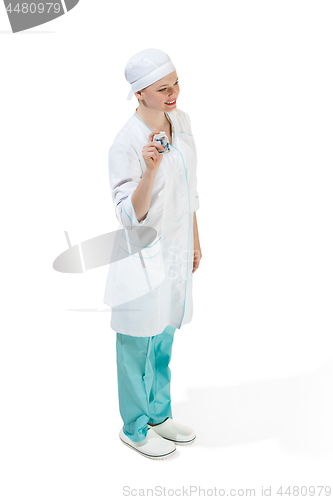 Image of Beautiful young woman in white coat posing at studio. Full length studio shot isolated on white.