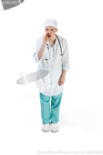 Image of Beautiful young woman in white coat posing at studio. Full length studio shot isolated on white.