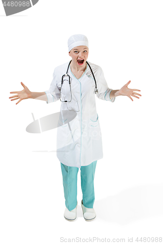 Image of Beautiful young woman is surprised in white coat posing at studio. Full length studio shot isolated on white.