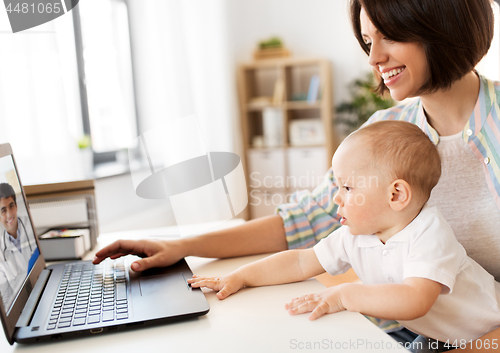 Image of mother with baby having video chat with doctor