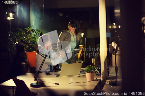 Image of young designers in the night office