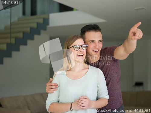 Image of couple hugging in their new home