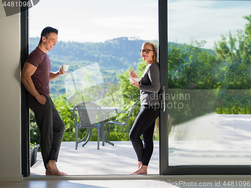 Image of couple on the door of their luxury home villa