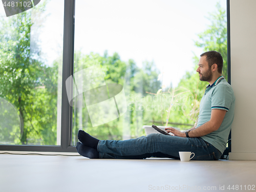 Image of man on the floor enjoying relaxing lifestyle