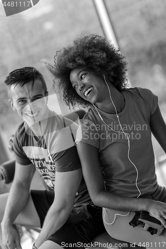 Image of couple in a gym have break