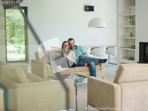 Image of couple relaxes in the living room