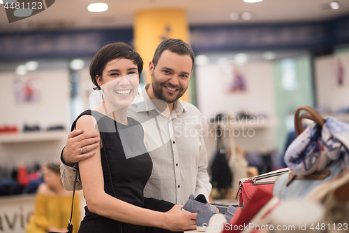 Image of couple chooses shoes At Shoe Store