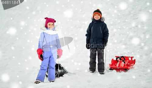 Image of happy little kids with sleds in winter