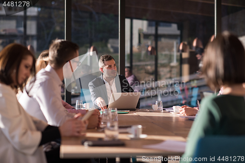 Image of Business Team At A Meeting at modern office building