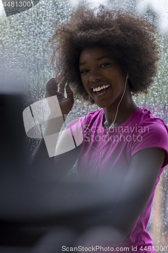 Image of portrait of young afro american woman in gym