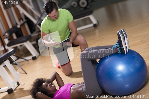 Image of pilates  workout with personal trainer at gym