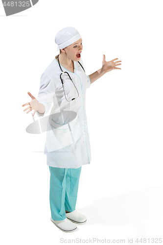 Image of Beautiful young woman is surprised in white coat posing at studio. Full length studio shot isolated on white.