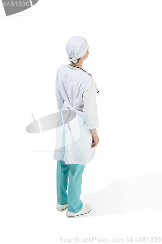 Image of Beautiful young woman in white coat posing at studio. Full length studio shot isolated on white.