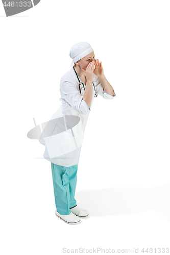 Image of Beautiful young woman in white coat posing at studio. Full length studio shot isolated on white.