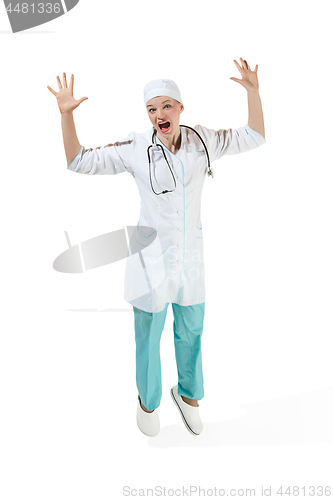 Image of Beautiful young woman in white coat posing at studio. Full length studio shot isolated on white.