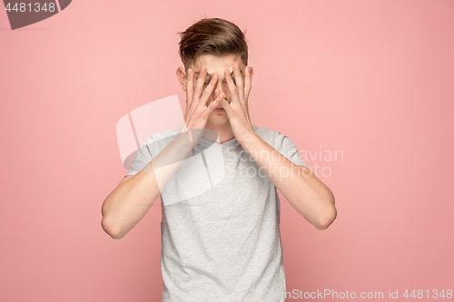 Image of Handsome man in stress isolated on pink