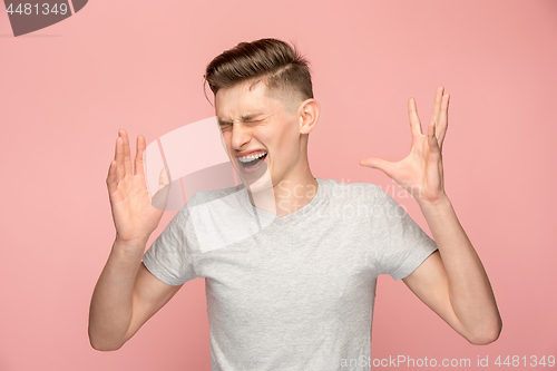 Image of Handsome man in stress isolated on pink