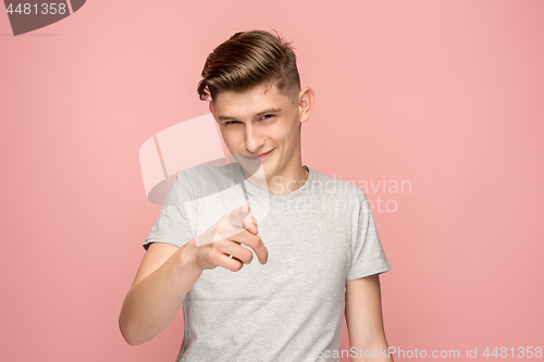 Image of The happy business man point you and want you, half length closeup portrait on pink background.