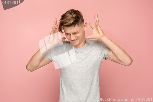 Image of Handsome man in stress isolated on pink