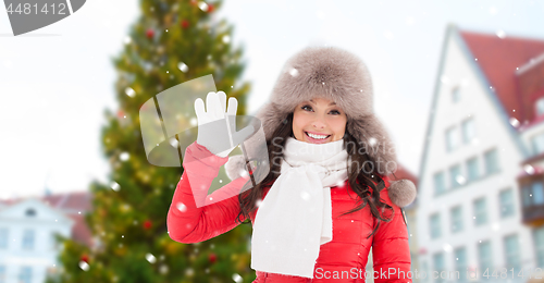 Image of happy woman over christmas tree in tallinn