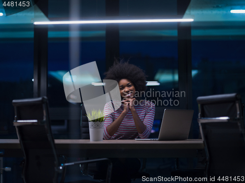 Image of black businesswoman using a laptop in startup office