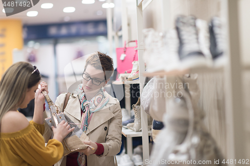 Image of best friend shopping in big mall