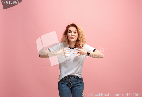 Image of Beautiful woman looking suprised isolated on pink