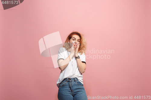 Image of Portrait of the scared woman on pink