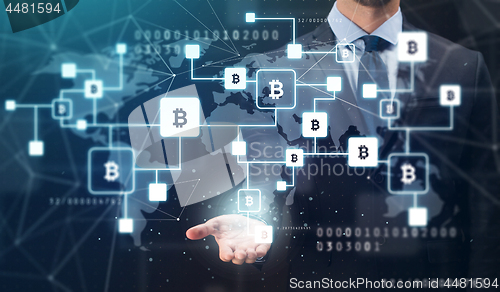 Image of close up of businessman with bitcoin block chain