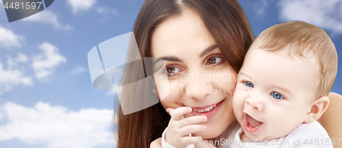 Image of mother with baby over sky background