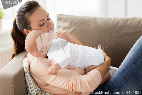 Image of happy mother with little baby boy at home