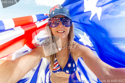 Image of Australian fan Celebrate Australia - woman with Australian flag