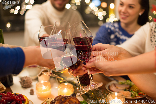 Image of close up of friends with wine celebrate christmas