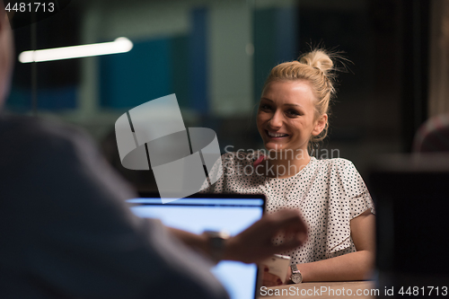 Image of Multiethnic startup business team in night office