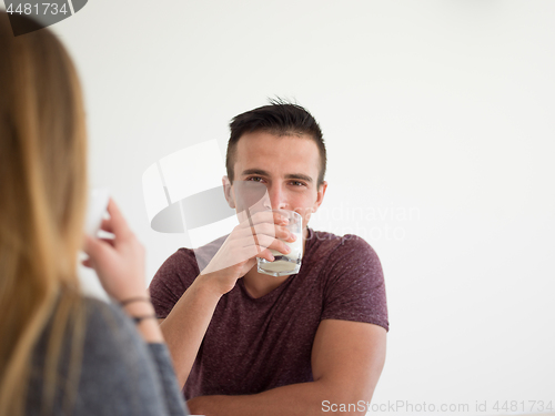 Image of couple enjoying morning coffee and strawberries