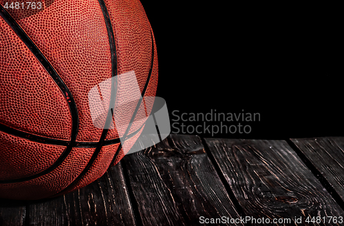 Image of Closeup old ball on a wooden floor