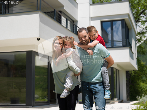 Image of happy family with children in the yard